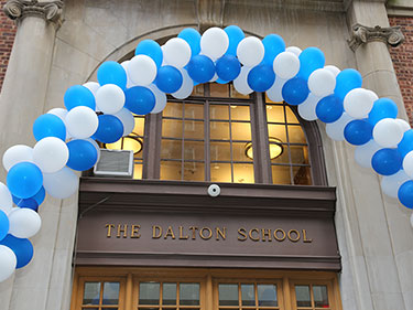 A balloon arch over the Dalton School doorway. 